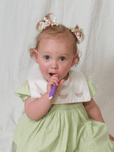 Cute Toddler Using A Toothbrush