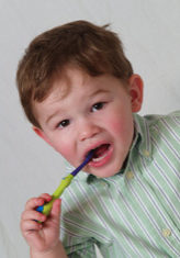 OLYMPUS DIGITAL CAMERA Young Child brushing teeth